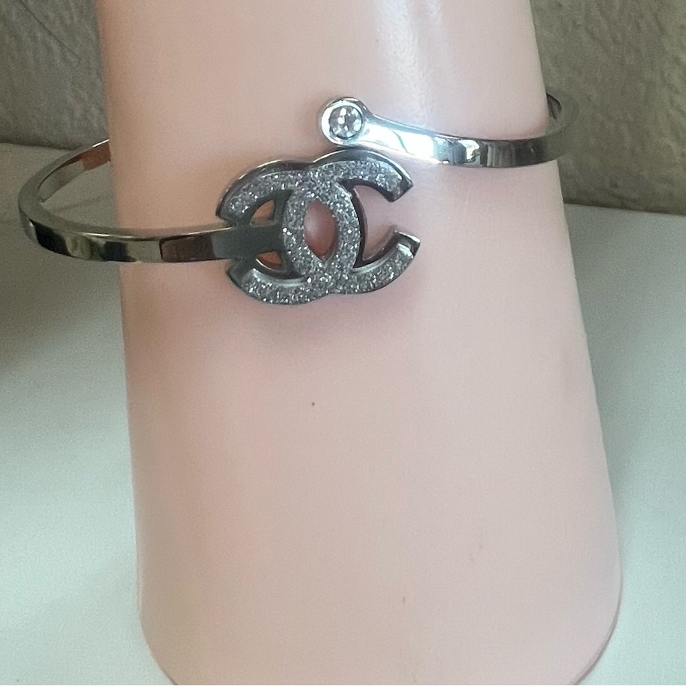 Silver Logo Bracelet with Crystal Accent. Excellent condition!